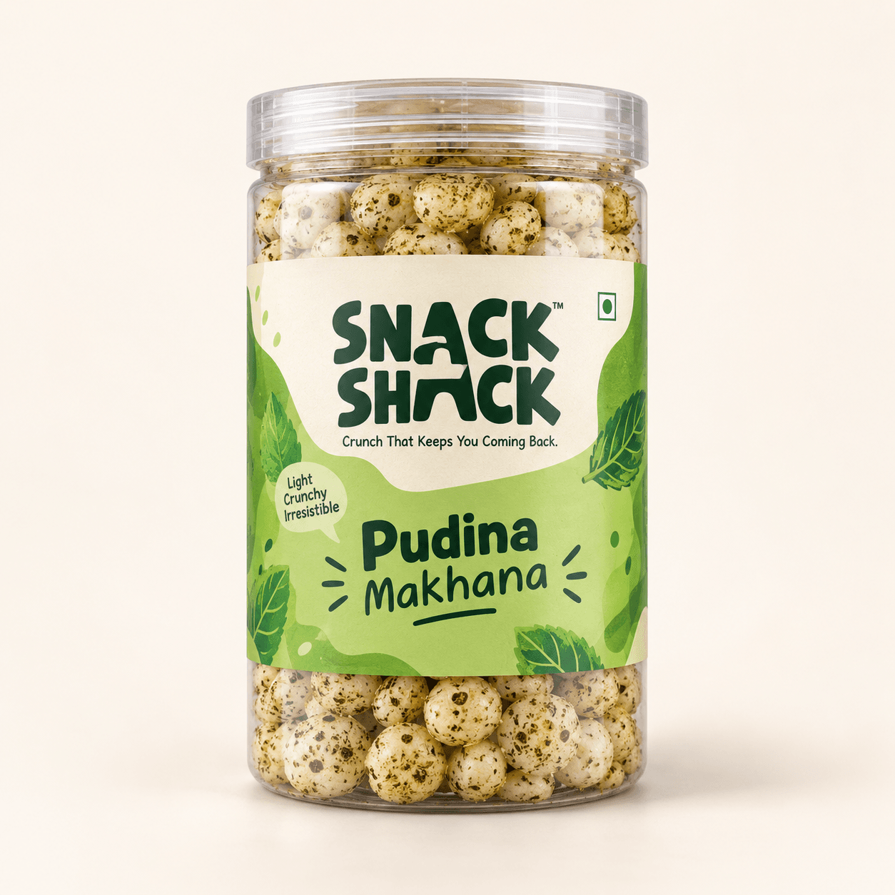 Snack Shack Pudina Makhana in a transparent cylindrical jar with a clear screw-on lid, shot on a plain cream background.